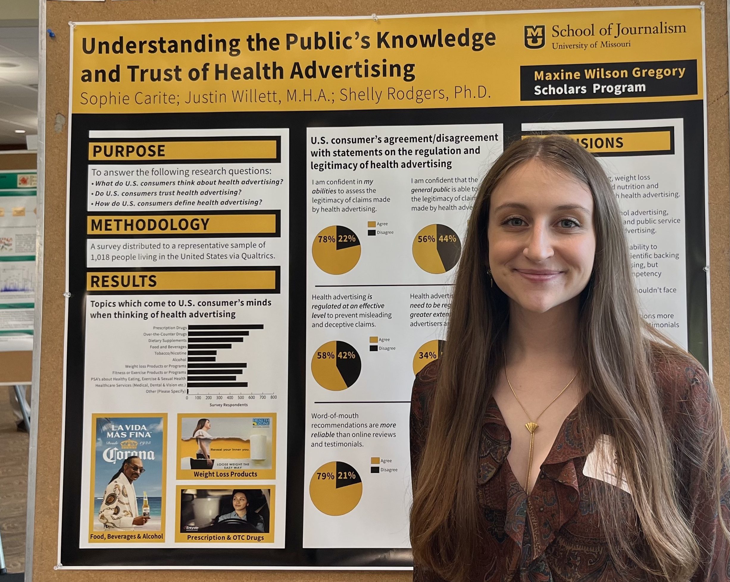 Photo of Sophie Carite with her research poster at the 2023 Spring Research Forum.