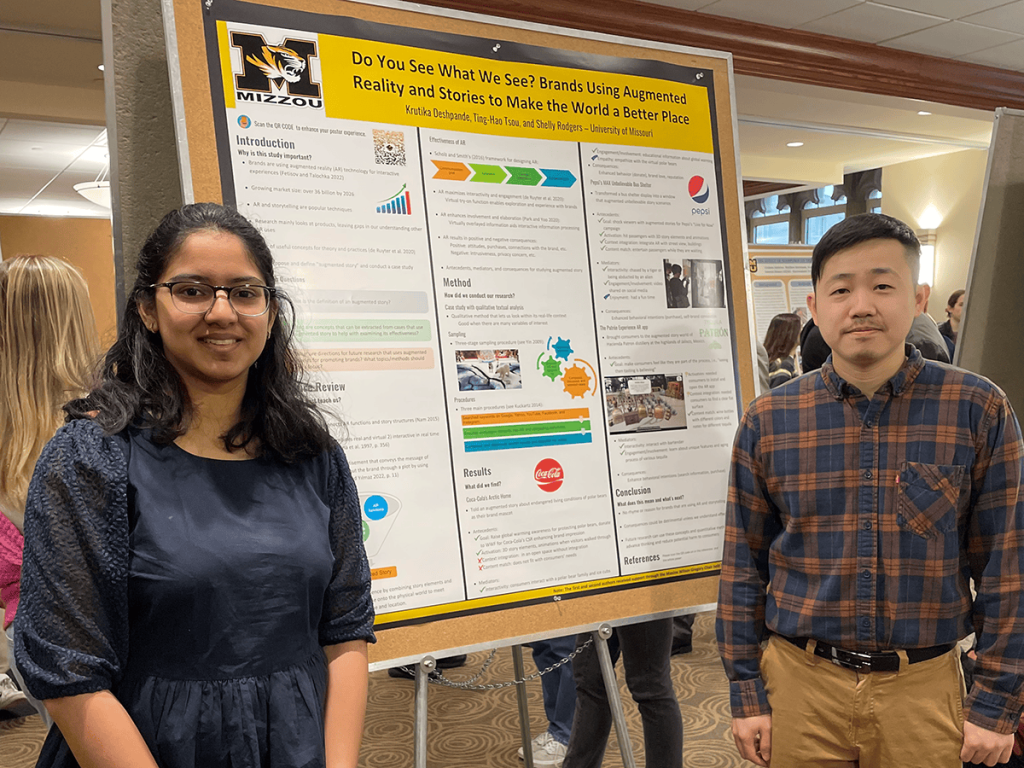 Photo of Ting-Hao Tsou and Krutika Deshpande with their research poster.